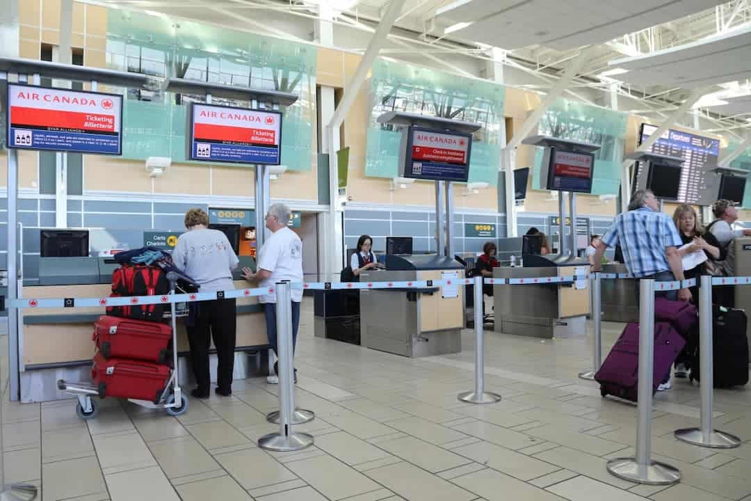 people at the airport registration desk 