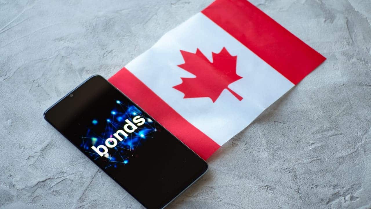 Bonds on cellphone screen and Canadian flag