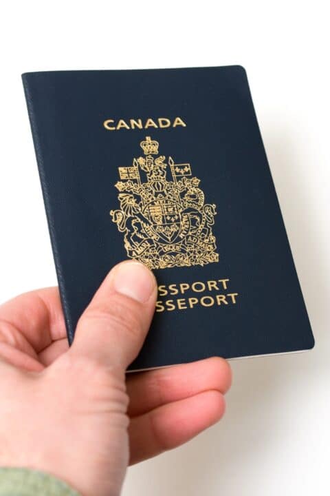 a hand holding the passport