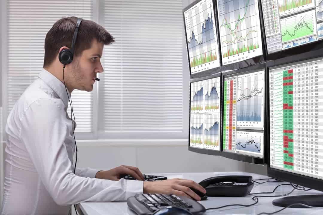 a zoung man with headset working in the office