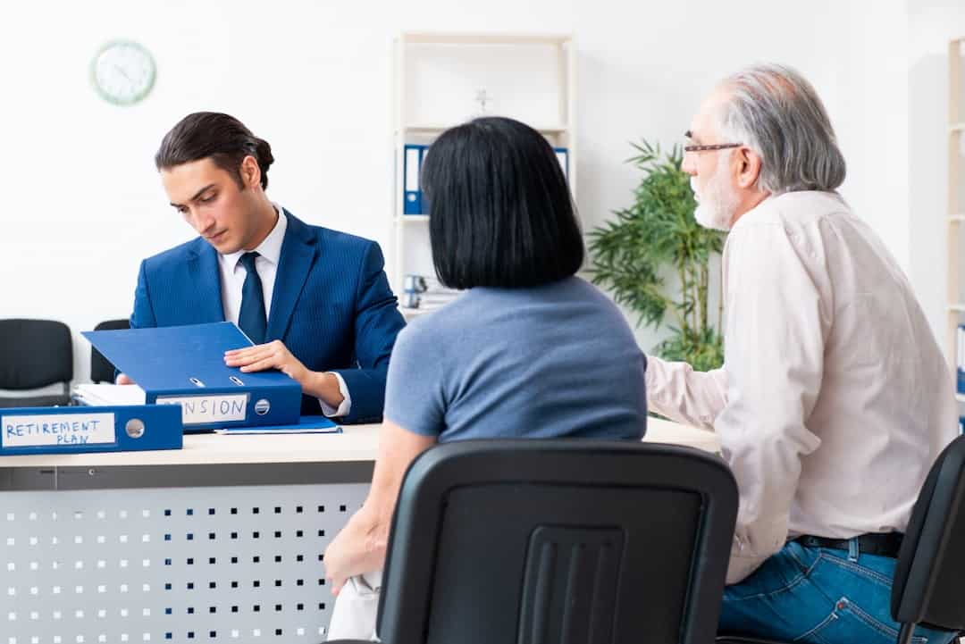 Financial advisor giving retirement advice to the senior couple