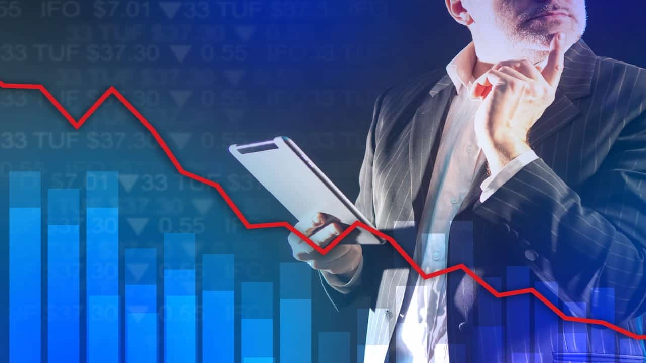 A man analyzes stock market data