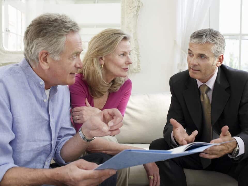 a senior couple with financial advisor