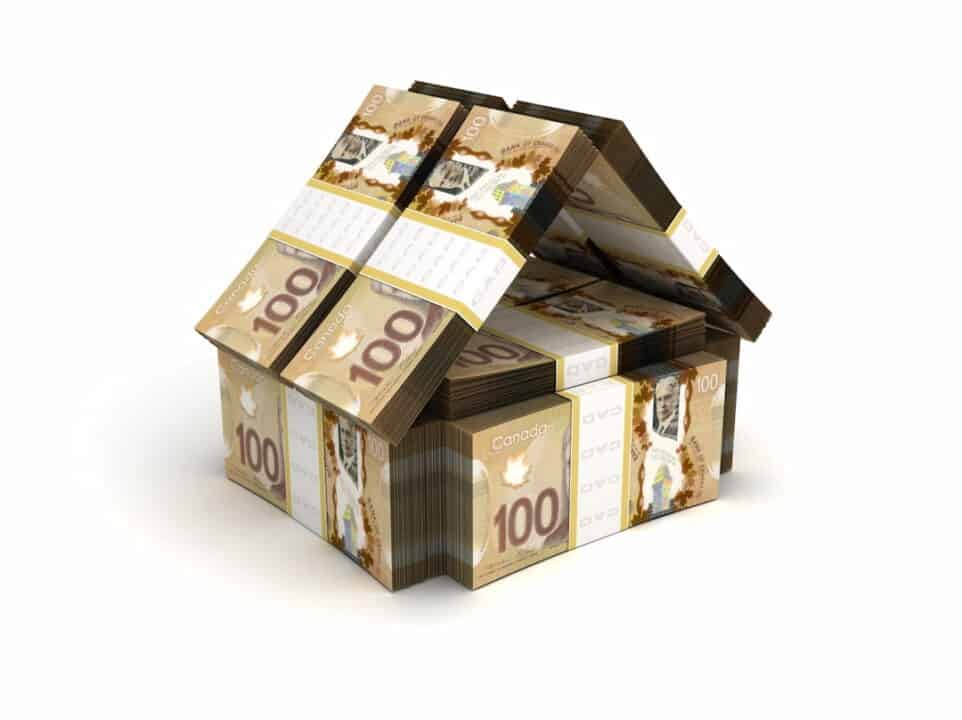 a house model made of Canadian dollars