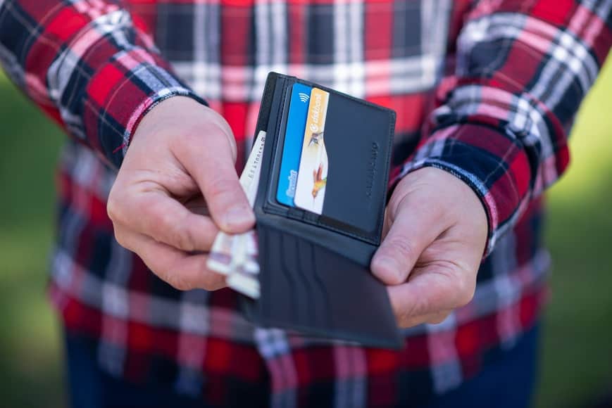 a person holding a wallet
