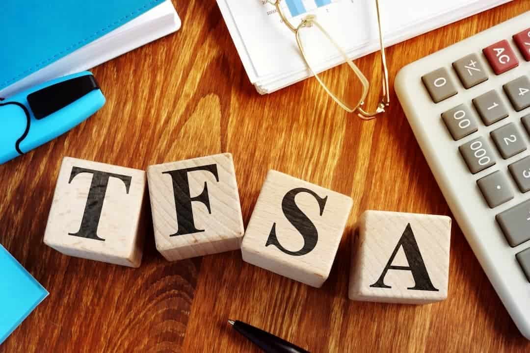 TFSA letters among calculator, glasses and documents on the table