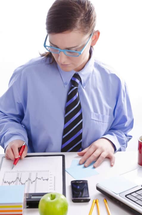 a woman analyzing charts in the office