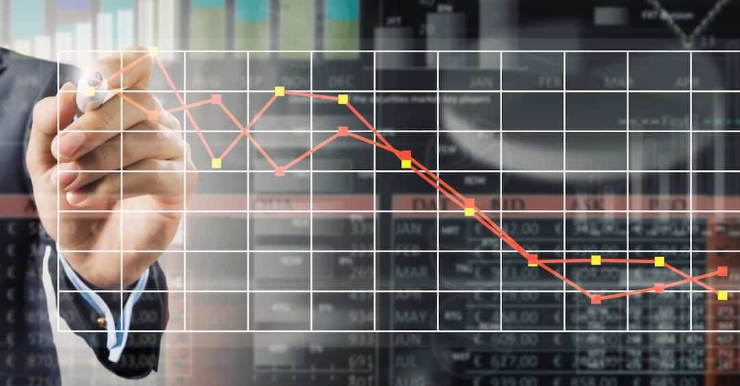 a man drawing points on a stock graph