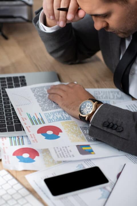 a man analyzing stock graphs