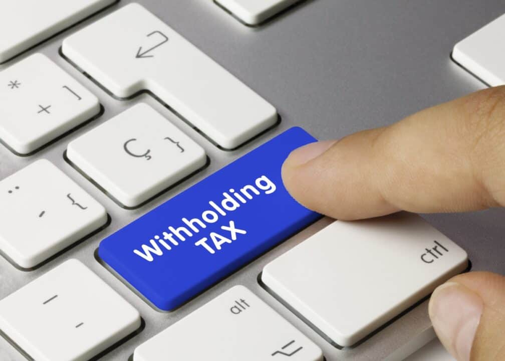 Withholding Tax key on the keyboard