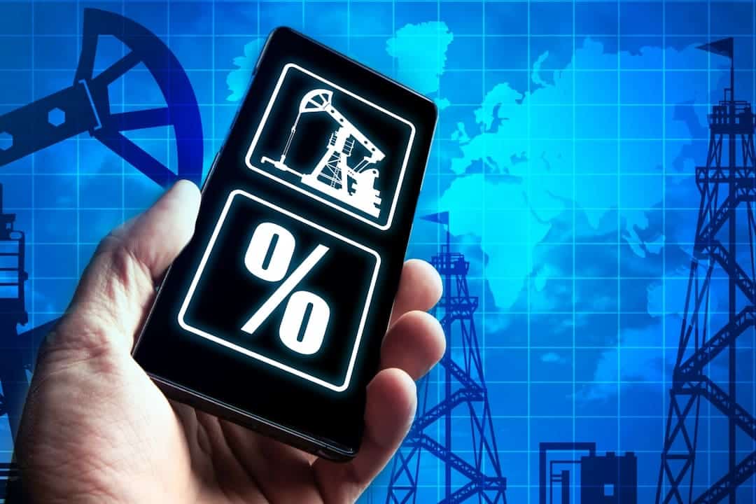 symbols of oil stocks and percentage on the mobile screen
