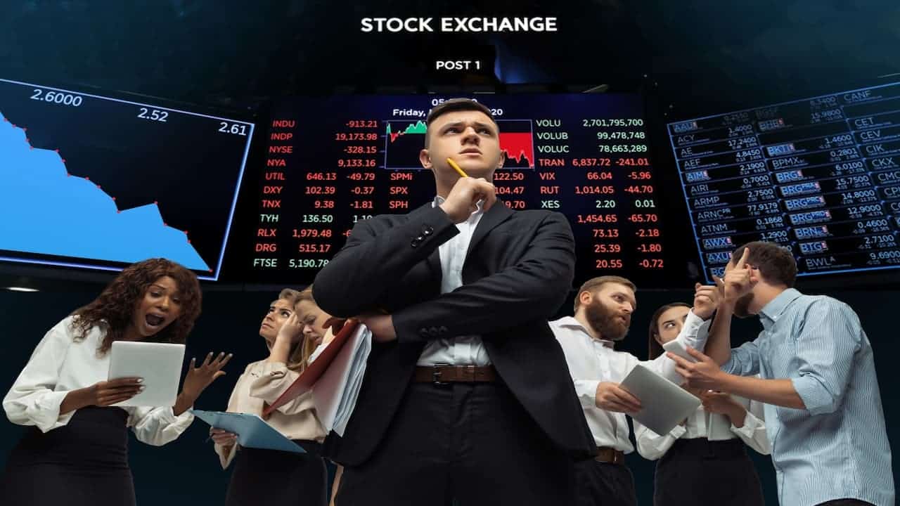 a group of stock traders in front of the stock board