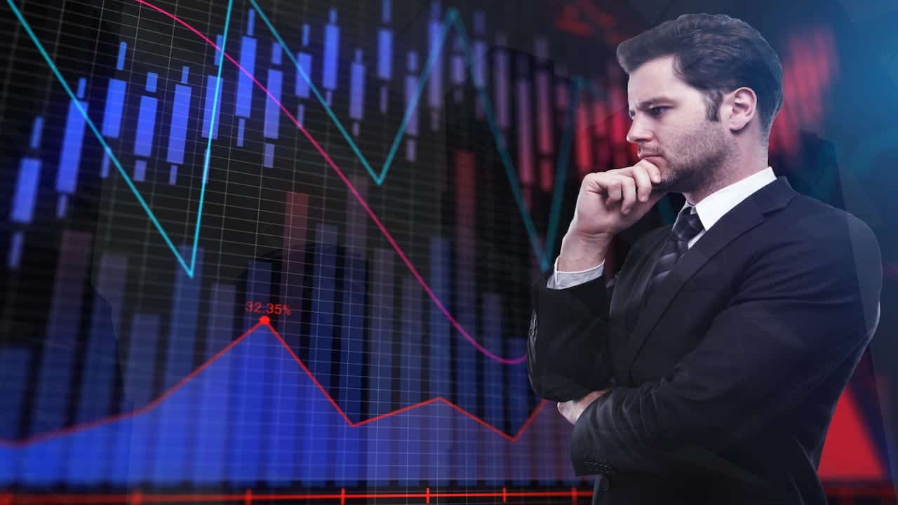 a man watching stock graph